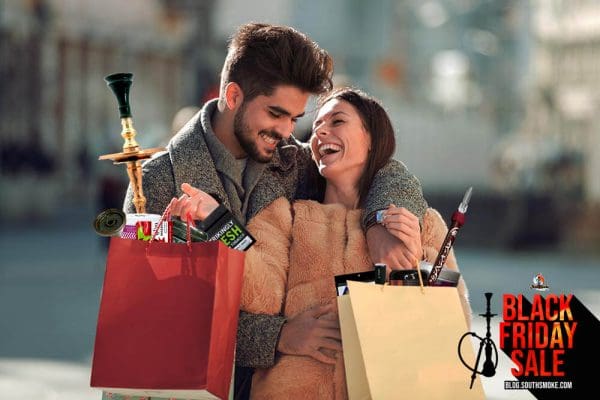 Man and woman with shopping bags of hookah accessories
