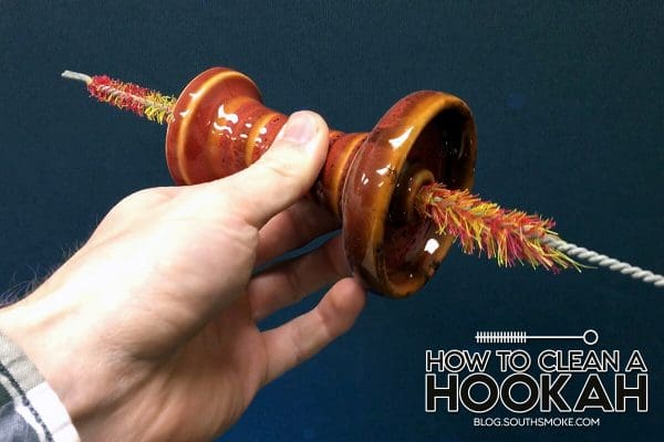 hand holding hookah bowl with pipe cleaner inside