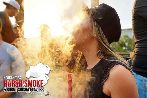 Woman with hat Blowing Hookah Smoke outside