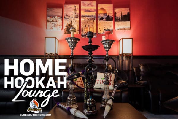 Hookah Lounge Atmosphere - room with couch and three tall hookahs on table