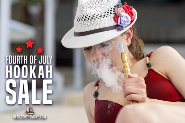 Woman smoking shisha flavors by the pool.