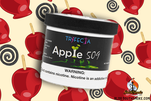 Trifecta Tobacco 250g container of apple 509 shisha with candied red apples in background